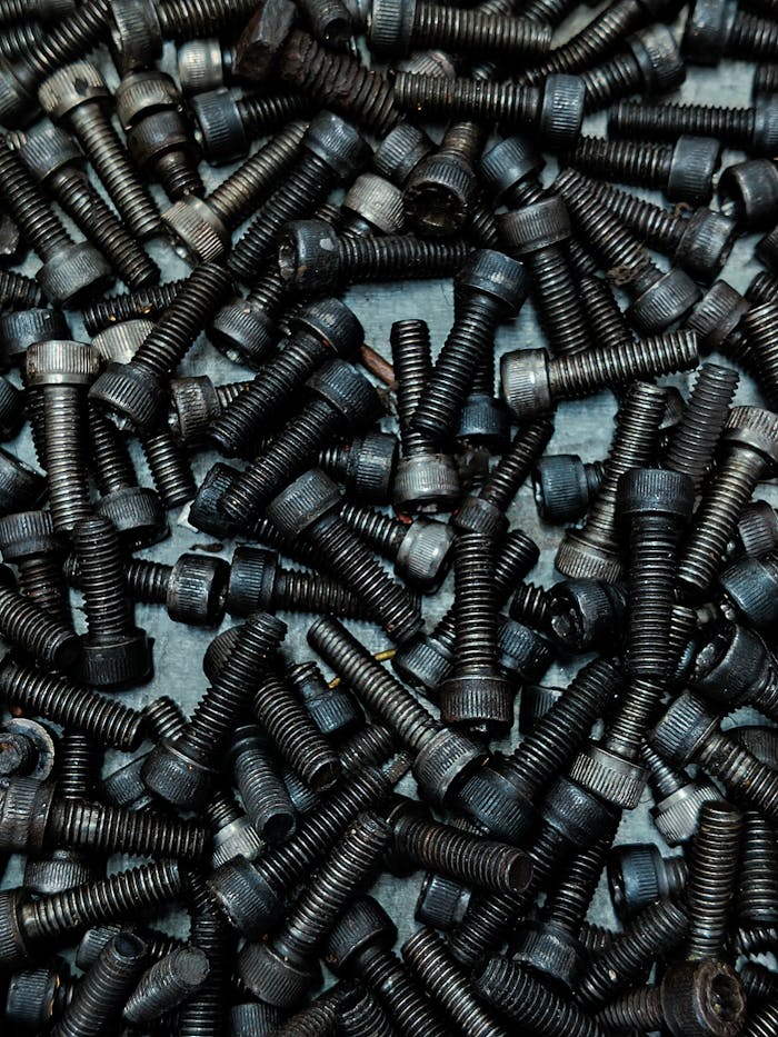 A collection of black screws perfect for DIY or construction projects, top view.